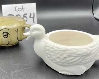 Lot 8254. $60.00 Lot of 8 side-handled infant/hospital/invalid feeders plus a cute duck shaped feeder that has a standard handle placement. 1) Gray, elephant snout feeder, 2) White duck with standard handle, 3) White, mini- side handle feeder, 4) cream colored - Royal Winton 'Made in England, 5) White, marked with an S under a crown made in Denmark, 6) white with a mark and #721, 7) marked #200 Schmid.