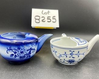 Lot 8255. $70.00. Lot of 7 side- handled infant/hospital/invalid feeders. All have a design and/or are colored in some way. 1) signed Vienna, Austria Edelweiss floral design,"Fur Genesung", which translates to "for recovery", 2) Cobalt blue color with floral images, 3) Purple violets, Vienna, Austria, 4) Pink rosebud design made in Victoria, Austria, 5) White with blue flower from London Covent Garden, 6) Lily of the Vally, marked #357, and 7) blue floral design embellishes the entire feeder cup.