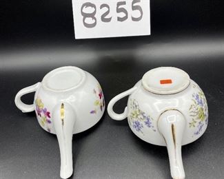 Lot 8255. $70.00. Lot of 7 side- handled infant/hospital/invalid feeders. All have a design and/or are colored in some way. 1) signed Vienna, Austria Edelweiss floral design,"Fur Genesung", which translates to "for recovery", 2) Cobalt blue color with floral images, 3) Purple violets, Vienna, Austria, 4) Pink rosebud design made in Victoria, Austria, 5) White with blue flower from London Covent Garden, 6) Lily of the Vally, marked #357, and 7) blue floral design embellishes the entire feeder cup.