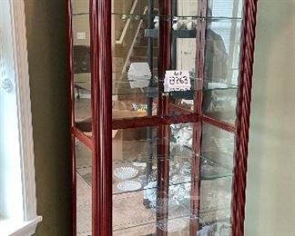 Lot 8263. $550.00. Curio Cabinet with two-way sliding door - matches the cabinet shown in lot 8262; however this is a little smaller. Really nicely crafted pieces will show off your valuables - lit and made by Illuminated Furniture, made in USA.