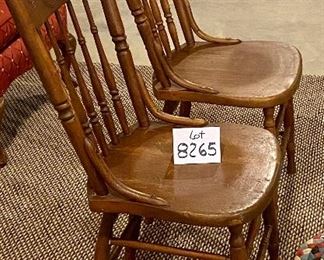 Lot 8265. $38.00 Pair of antique or vintage wooden chairs with carved spindle backs and two rag rug cushions. 16" W x 19" D x 37" T