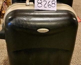 Lot 8268. $50.00. Two black, industrial hard-sided Samosonite TSA002, 4-wheeled suitcases. The smaller is a carry-on, They are pretty indestructible! 1) 15" W x 9" D x 24" T, 2) 18" W x 10" D x 28" T