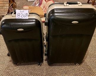 Lot 8268. $50.00. Two black, industrial hard-sided Samosonite TSA002, 4-wheeled suitcases. The smaller is a carry-on, They are pretty indestructible! 1) 15" W x 9" D x 24" T, 2) 18" W x 10" D x 28" T