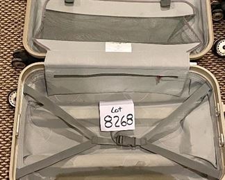 Lot 8268. $50.00. Two black, industrial hard-sided Samosonite TSA002, 4-wheeled suitcases. The smaller is a carry-on, They are pretty indestructible! 1) 15" W x 9" D x 24" T, 2) 18" W x 10" D x 28" T. View of Inside of Larger Bag. There is a dark spot right below the straps on the lower section.