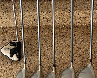 Lot 8271. $235.00. Women's Taylor-Made Miscela RH Clubs, Ultralite Graphite- Ladies Flex 7 (Irons- 7, 8, 9, P, S) & (Woods 1, 3, 4, 5, 7), Odyssey "White Hot" 2-ball blade putter. Excellent condition, Head covers may be available but aren't shown. What a deal!