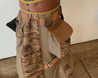 Lot 8272. $85.00. Vintage Bennington Golf Cart Bag, Brown and tan colors with golfers on bag. Lone Palm golf towel and 4 cammo head covers (Cover shown does not belong with this Bag, which btw was used by a woman golfer, and it's cute.