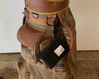 Lot 8272. $85.00. Vintage Bennington Golf Cart Bag, Brown and tan colors with golfers on bag. Lone Palm golf towel and 4 cammo head covers (Cover shown does not belong with this Bag, which btw was used by a woman golfer, and it's cute.