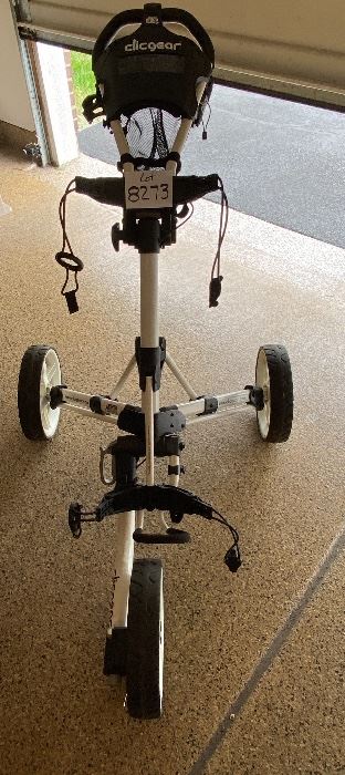 Lot 8273. $180.00. Clicgear Model 3.5+ bag pull cart, easily folds up to fit in your trunk. New these carts cost $500+. If Tesla made a Golf Cart this would be the one.
