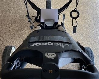 Lot 8273. $180.00. Clicgear Model 3.5+ bag pull cart, easily folds up to fit in your trunk. New these carts cost $500+. If Tesla made a Golf Cart this would be the one.