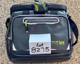 Lot 8275. $35.00. Titan Deep Freeze Zipperless Coldlok "Radiant Barrier Technology" Portable Cooler...very nice! This item has a plastic tray that sits above the bottom to keep your food dry.