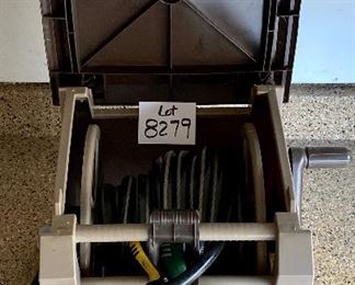 Lot 8279. $32.00 Ames True Temper Hose Reel Stand with hose and nozzle, "never leak hose" cabinet. small crack on top, negligible.