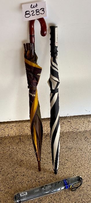 Lot 8283. $20,00 3 umbrellas. 1 golf umbrella, 1 reg, 1 compact travel. One for the car, one for the Golf Course and one for your office...