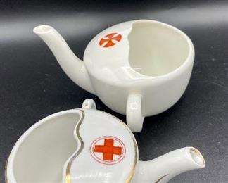 Lot 8257. $60.00. Lot of 6, side-handled infant/hospital/invalid feeders all with some design. 1) Red Cross, #4767 on bottom, 2) red, yellow & blue design and image of baby, 3) Red Cross/gold trim, marked "98" on bottom, 4) Pink & plum floral, marked "7317", 5) Purple floral with gold, 6) blue floral. Our favorite lot.