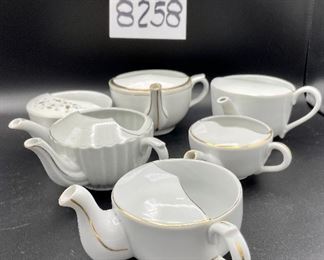 Lot 8258. $36.00. Lot of 6, side-handled infant/hospital feeders all in white with gold accents. 1) ribbed sides, 2) "made in Germany", 3) marked, 3043, 4) Purchased in London, hearts and flowers in gold, 5) marked MAW, 6) white and gold.