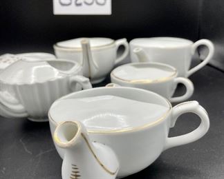 Lot 8258. $36.00. Lot of 6, side-handled infant/hospital feeders all in white with gold accents. 1) ribbed sides, 2) "made in Germany", 3) marked, 3043, 4) Purchased in London, hearts and flowers in gold, 5) marked MAW, 6) white and gold.