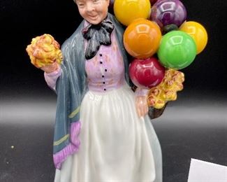 Lot 8259. $60.00 5 pc lot of English Country decorative items: 1) Royal Doulton "Biddy Pennyfarthing" balloon lady figurine; 2) Antique Shoppe Music box with thatched roof 6" x 4" and marked RF Tam 2813183; 3) Cottage with thatche roof music box, Made in England; 4) Apothecary's Shoppe mini house by David Winter; 5) Lighthouse mini house.
