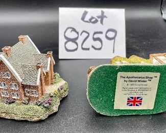 Lot 8259. $60.00 5 pc lot of English Country decorative items: 1) Royal Doulton "Biddy Pennyfarthing" balloon lady figurine; 2) Antique Shoppe Music box with thatched roof 6" x 4" and marked RF Tam 2813183; 3) Cottage with thatche roof music box, Made in England; 4) Apothecary's Shoppe mini house by David Winter; 5) Lighthouse mini house.