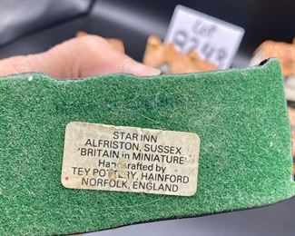 Lot 8243. $48.00. Tey Pottery "Britan in Miniature" Houses, lot of 6 houses. Includes: Lord Nelson, Post Office (with minor chip), Star Inn Alfriston, Sussex, Tey Pottery Studio, Blue Bell (Public House Countryside), Friars House Cambridge.