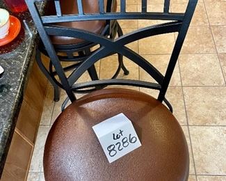 Lot 8286.$120.00 3 metal frame swivel bar stools from, 300 lb max.weight load, wood accent on back with faux brown leather seats. 45"t x 29" seat height x 18" dia