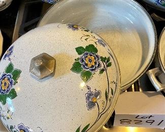 Lot 8291. $95.00. 1851 ASTA German Enamel Cookware, 7 pc. 10" fry pan w/lid, 10" dia dutch oven w/lid, 2 double handled pans, 8"dia x 2.5"t pan (no lid), 8" dia x 5"T pan (no lid), 6.5" lid - no pan. Purple, gold, green floral patterns.