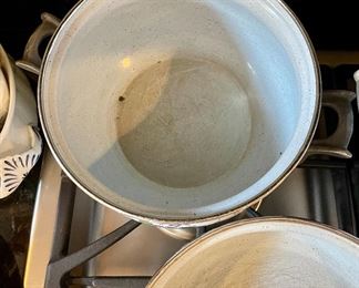 Lot 8291. $95.00. 1851 ASTA German Enamel Cookware, 7 pc. 10" fry pan w/lid, 10" dia dutch oven w/lid, 2 double handled pans, 8"dia x 2.5"t pan (no lid), 8" dia x 5"T pan (no lid), 6.5" lid - no pan. Purple, gold, green floral patterns.