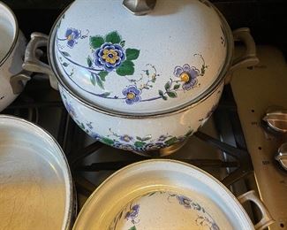 Lot 8291. $95.00. 1851 ASTA German Enamel Cookware, 7 pc. 10" fry pan w/lid, 10" dia dutch oven w/lid, 2 double handled pans, 8"dia x 2.5"t pan (no lid), 8" dia x 5"T pan (no lid), 6.5" lid - no pan. Purple, gold, green floral patterns.