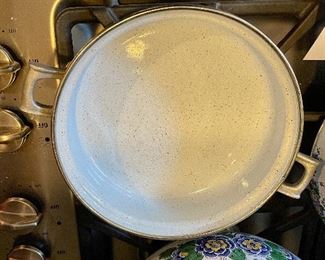 Lot 8291. $95.00. 1851 ASTA German Enamel Cookware, 7 pc. 10" fry pan w/lid, 10" dia dutch oven w/lid, 2 double handled pans, 8"dia x 2.5"t pan (no lid), 8" dia x 5"T pan (no lid), 6.5" lid - no pan. Purple, gold, green floral patterns.