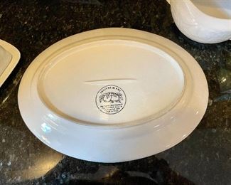 Lot 8295. $75.00. 10 pc. of White Fruits de blanc dinnerware serving pieces, featuring fruit decor in relief on all pieces, includes: 14" oval platter, covered butter dish, creamer, sugar, salt and pepper, gravy/saucer, 2 dinner plates or cookie plates, and a white Kaiser tankard or pitcher 9.5" T.