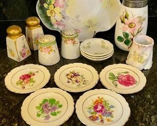 Lot 8296. $45.00. Beautiful and colorful 15 pc. mixed lot of antique hand-painted pieces. 1 pc Lampnan ?painted s&p, 1 pr Nippon hand painted s&p shakers, porcelain hand, set of 3 Johnson Bros tea bag saucers, and set of 5 painted floral theme plates with gold trim. Photo describes better than me!