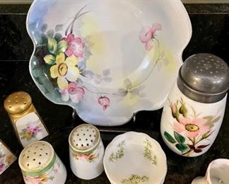 Lot 8296. $45.00. Beautiful and colorful 15 pc. mixed lot of antique hand-painted pieces. 1 pc Lampnan painted s&p, 1 pr Nippon hand painted s&p shakers, porcelain hand, set of 3 Johnson Bros tea bag saucers, and set of 5 painted floral theme plates with gold trim. Photo describes better than me!