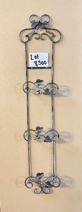 Lot 8300. Pewter look 3 plate rack with grape designs. 36" L x 8" W.