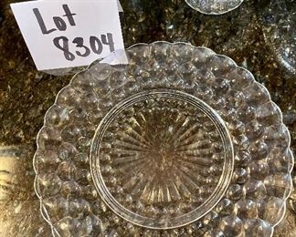 Lot 8304. $26.00 Lot of vintage glass serving pieces: 3- 9" plates with a bubble look; 2 small pedestal bowls; a large serving bowl (8.5" x 3"T); and a large 15" glass platter.