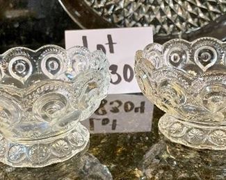 Lot 8304. $26.00 Lot of vintage glass serving pieces: 3- 9" plates with a bubble look; 2 small pedestal bowls; a large serving bowl (8.5" x 3"T); and a large 15" glass platter.