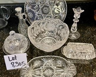 Lot 8305. $30.00 7 pc lot of cut glass serving pieces: covered butter dish, candle stick, cruet with stopper, divided relish tray, domes covered dish (6" Diam x 4.5" T), lg. bowl (8.5" x 5"T), 11" diameter plate - great serving piece).
