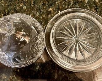Lot 8305. $30.00 7 pc lot of cut glass serving pieces: covered butter dish, candle stick, cruet with stopper, divided relish tray, domes covered dish (6" Diam x 4.5" T), lg. bowl (8.5" x 5"T), 11" diameter plate - great serving piece).