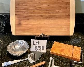 Lot 8310. $27.00 Lot of appetizer items. Bamboo cutting board (great for charcuterie too) 18" x 12"; cheese plane, cheese slicer, spreader, guillotine cheese slicer and an Armatelle dip bowl.