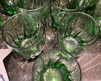 Lot 8319. $28.00. 10 Pc Lot includes: Green glassware ( 4 tall tumblers and 5 juice glasses) and a metal cocktail shaker.