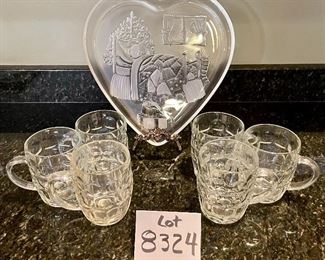 Lot 8324. $32.00 6 " made in England Ravenshead" handled mugs and a heart shaped glass platter with a Christmas Bear image.