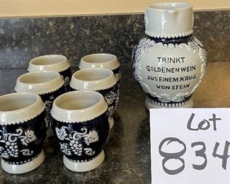 Lot 8345. $40.00 German salt glazed Pitcher and 6 small steins by Trinkt Goldenenwein Aus Einem Drug Vonstein.