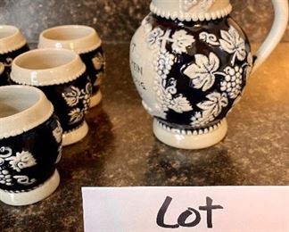 Lot 8345. $40.00 German salt glaze Pitcher and 6 small steins by Trinkt Goldenenwein Aus Einem Drug Vonstein.