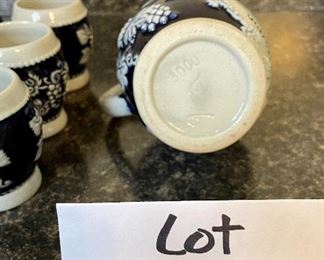 Lot 8345. $40.00 German salt glaze Pitcher and 6 small steins by Trinkt Goldenenwein Aus Einem Drug Vonstein.