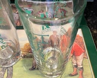 Lot 8349. $35.00. Golf beverage assortment including 5 Jason vintage golf scene placemats, 4 Old Fashioned glasses, each with an etched design of different courses - Augusta, Pinehurst, Firestone & Doral- with hole stats; 2 golf themed cups and 2 golf themed tumblers.