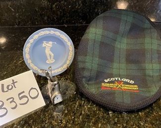 Lot 8350. $45.00. Black Watch plaid golf hat (tam) from Ghillie Products Scotland featuring Glen Eagles, St. Andrews, Muirfield and Turnberry on the front of the hat. Also included are a miniature golf bag clock and a Jasperware golf themed mini plate.