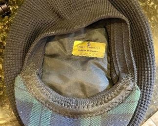 Lot 8350. $45.00. Black Watch plaid golf hat (tam) from Ghillie Products Scotland featuring Glen Eagles, St. Andrews, Muirfield and Turnberry on the front of the hat. Also included are a miniature golf bag clock and a Jasperware golf themed mini plate.