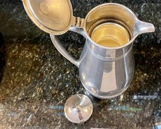 Lot 8352. $32.00 Calphalon stainless steel ice bucket/champagne bucket 7.5" T and a Landers, Frary & Clark Universal Butler (thermos pitcher with cork stopper).
