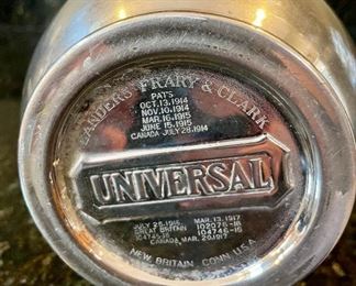 Lot 8352. $32.00 Calphalon stainless steel ice bucket/champagne bucket 7.5" T and a Landers, Frary & Clark Universal Butler (thermos pitcher with cork stopper).