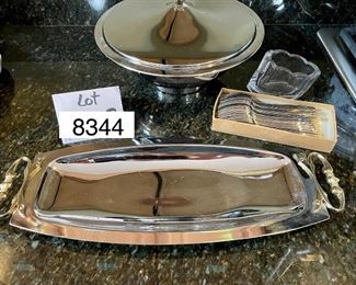 Lot 8344. $42.00 Vintage mid-Century modern Kromex serving bowl (11.5" diam) with an 8" glass insert, and a 'Kromex' tray with brass handles (17" L x 7" W) 35 salad/dessert forks with glass buffet caddy.