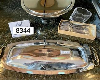 Lot 8344. $42.00 Vintage mid-Century modern Kromex serving bowl (11.5" diam) with in 8" glass insert, and a 'Kromex' tray with brass handles (17" L x 7" W)35 salad/dessert forks with glass buffet caddy.