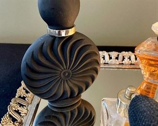 Lot 8360. $90.00 Perfume Lot includes: Mirrored dresser/vanity tray and opened perfume bottles including White Linen by Estee Lauder, Tresor by Lancome, a black perfume bottle and two bottles with atomizers.