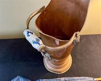 Lot 8365. $55.00 Brass umbrella stand with Delft porcelain handle, made in Holland. 22" T x 11" W, includes blue paisley print umbrella.
